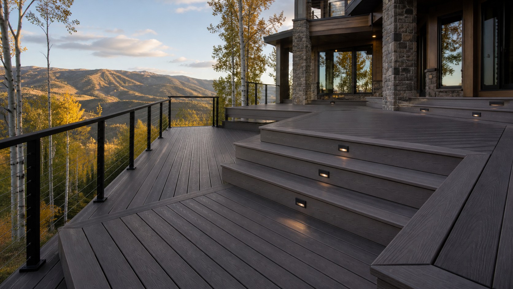 Multi-level charcoal composite deck with integrated lighting and a Utah mountain view